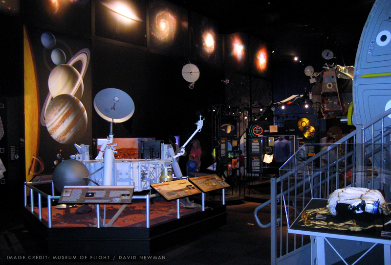 Museum of Flight space exhibit featuring Solar System mural by Dave Ginsberg