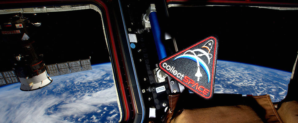 collectSPACE patch floating on the International Space Station. Design by Dave Ginsberg