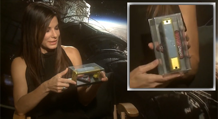 Sandra Bullock with a surprise gift of a space artifact